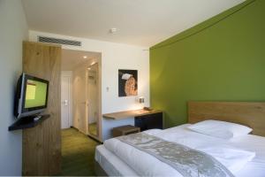 TV a/nebo společenská místnost v ubytování Fürstenfelder Hotel