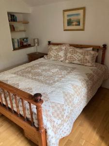 Posteľ alebo postele v izbe v ubytovaní Garden Cottage