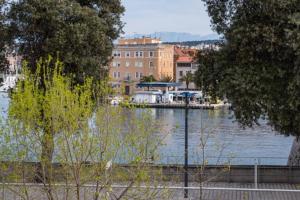 a view of a body of water with buildings at IL MURO apartment in Zadar
