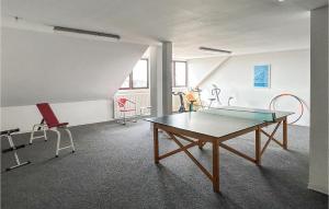 a room with a ping pong table and chairs at Gorgeous Apartment In Büsum With Wifi in Büsum