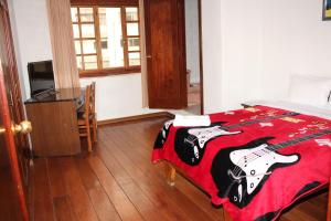 Postel nebo postele na pokoji v ubytování Hostal La Catolica