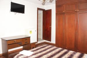 Postel nebo postele na pokoji v ubytování Hostal La Catolica