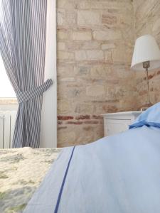 A bed or beds in a room at LA CONCHIGLIA - Sirolo Suite