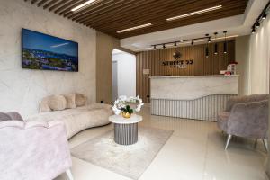 a living room with a couch and a table at Street 55 Hotel in Bucaramanga