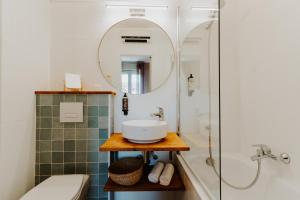 a bathroom with a sink and a shower at Hôtel Le Petit Castel in Antibes