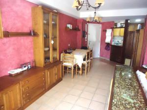 a kitchen with a table and a dining room at Tierra de Irta P B LEK in Peñíscola
