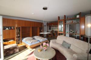 a living room with a couch and a table at Panorama Whg 62, 4 OG in Cuxhaven