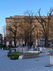 a large building with trees in front of it at roomspoznan pl - Ogrodowa 9 - 24h self check-in in Poznań