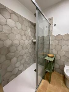 a bathroom with a glass shower and a toilet at Casa la Rosa in Gubbio +42 photos