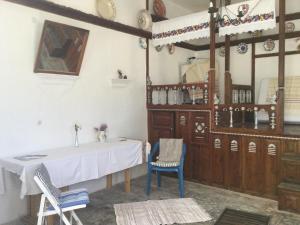 a dining room with a table and two chairs at Olympos Traditional House in Olympos