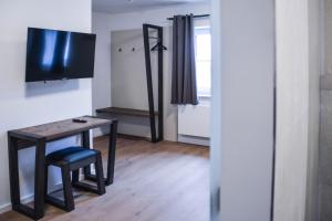 TV a/nebo společenská místnost v ubytování Hotel Pame Grill + 24 fotografií