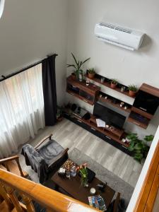 an overhead view of a living room with a table at István Vendégház - Zsóryfürdő in Szihalom