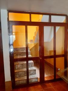 an open door leading to a stairway with glass at Casa La Ruta Pisco in Pisco