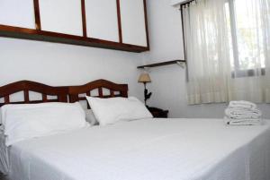 Ein Bett oder Betten in einem Zimmer der Unterkunft Laerte Hotel Mendoza