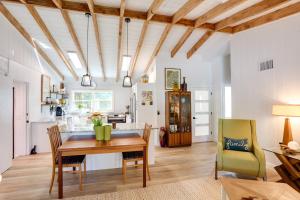 a kitchen and dining room with a table and chairs at Pet-Friendly Home about 6 Mi to Jensen Beach Park! in Jensen Beach +25 photos