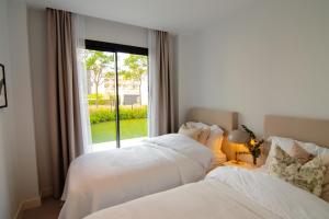 A bed or beds in a room at Mara's Apartments Higueron West - Like A House - 246 Square Meters of Private Terrace & Garden - Morning and Evening Sun