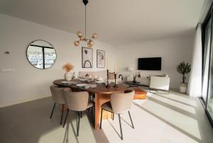 A television and/or entertainment centre at Mara's Apartments Higueron West - Like A House - 246 Square Meters of Private Terrace & Garden - Morning and Evening Sun