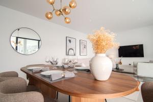 A television and/or entertainment centre at Mara's Apartments Higueron West - Like A House - 246 Square Meters of Private Terrace & Garden - Morning and Evening Sun