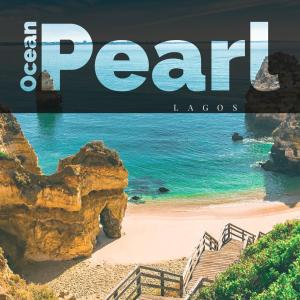 a magazine cover of a beach with the words real lagos at Ocean pearl in Lagos