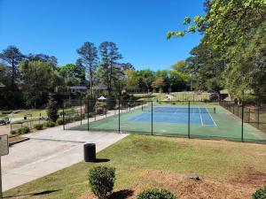 a tennis court in the middle of a park at Historic Ingleside Avenue Charm in Macon