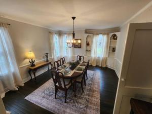 a dining room with a table and chairs at Historic Ingleside Avenue Charm in Macon