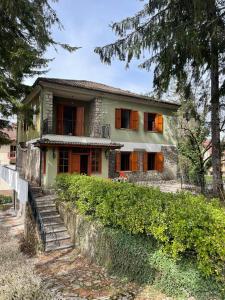 an old house with trees in front of it at Villa prestigiosa ampie metrature in Altipiani di Arcinazzo
