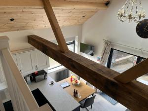 an overhead view of a kitchen and dining room with a table at Stonecroft Cwtch in Haverfordwest