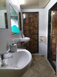 a bathroom with a sink and a mirror at Super Champions Hostel in Mumbai