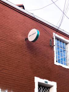 a frisbee on the side of a red brick building at Ancestral Hostel in Bogotá
