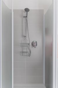 a shower with a glass door with a shower at Casa Nanni - Pesaro in Pesaro