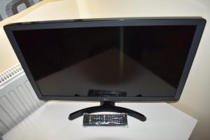 a computer monitor sitting on top of a table at Shaz,s House in Cowley