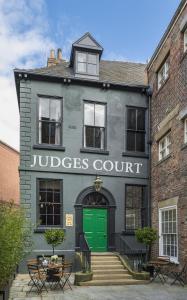 a green door on the front of a building at Judges Court in York
