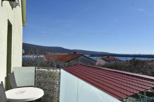 a toilet sitting on the balcony of a house at Denjak Apartments in Kornić