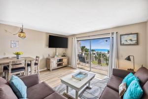 a living room with a view of the ocean at The Summit 307 in Panama City Beach