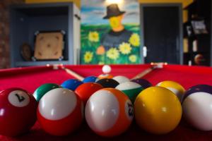 a group of billiard balls on a pool table at THE FOX RETREAT in Mukteshwar