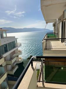 a balcony with a view of the water at The Blue Horizon in Vlorë