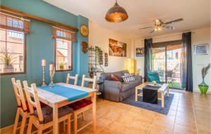 a living room with a table and a couch at Gorgeous Home In Isla Plana With Wifi in Isla Plana
