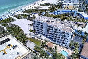 an aerial view of a building next to the beach at Siesta Sands Beach Resort Gulf View in Sarasota