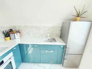 Kuchyňa alebo kuchynka v ubytovaní Urban Jungle - luksusowy apartment w Gdyni.