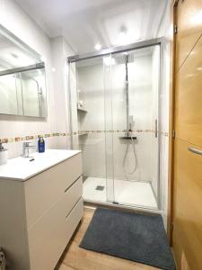 a bathroom with a shower and a sink at Best location for the perfect vacation in Playa de San Juan