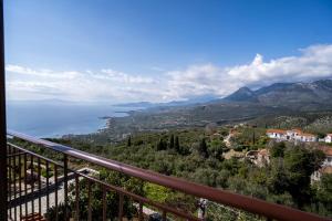 a view of the ocean from the balcony of a house at Sea & Mountain Serenity in Plátsa