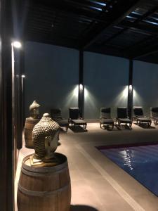a room with a statue next to a swimming pool at Hotel Boutique BC Wine Casablanca in Casablanca