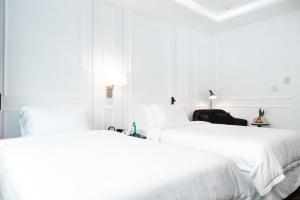 Postel nebo postele na pokoji v ubytování Hotel Tano Guam