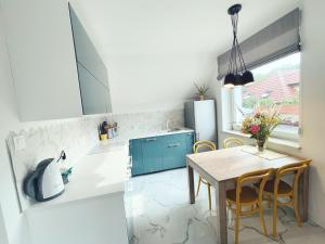 Kuchyňa alebo kuchynka v ubytovaní Urban Jungle - luksusowy apartment w Gdyni.