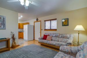 a living room with a couch and a refrigerator at Cozy Las Cruces Home - 2 Mi to New Mexico State! in Las Cruces