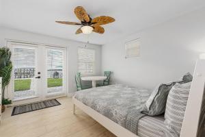 a bedroom with a bed and a ceiling fan at Matlacha on Shoreview in Matlacha