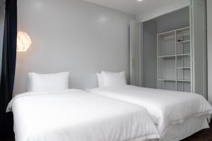 Postel nebo postele na pokoji v ubytování Hotel Tano Guam