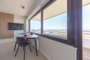 TV a/nebo společenská místnost v ubytování Appartement Ocean Suite