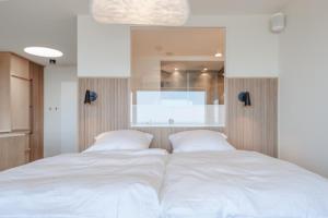 Postel nebo postele na pokoji v ubytování Appartement Ocean Suite