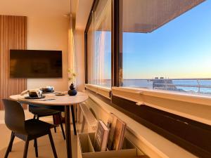 TV a/nebo společenská místnost v ubytování Appartement Ocean Suite
